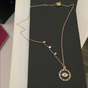 Gold third eye necklace